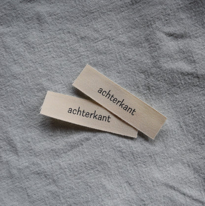 innaailabel 'achterkant'